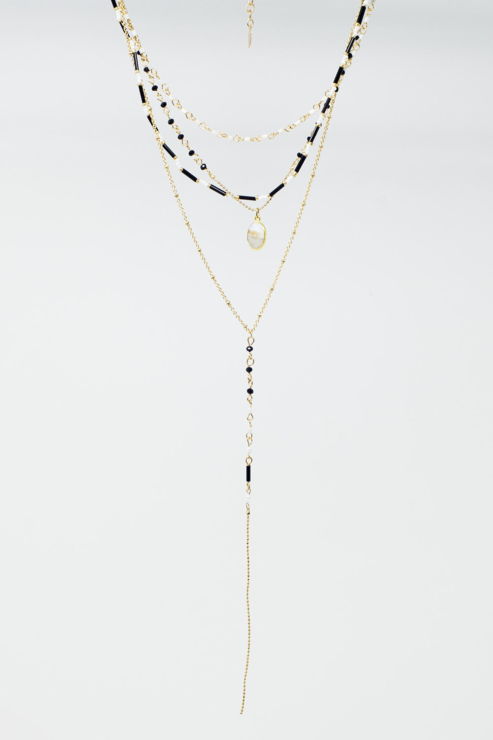 Gold 4 in 1 Necklace With Black and White Beads