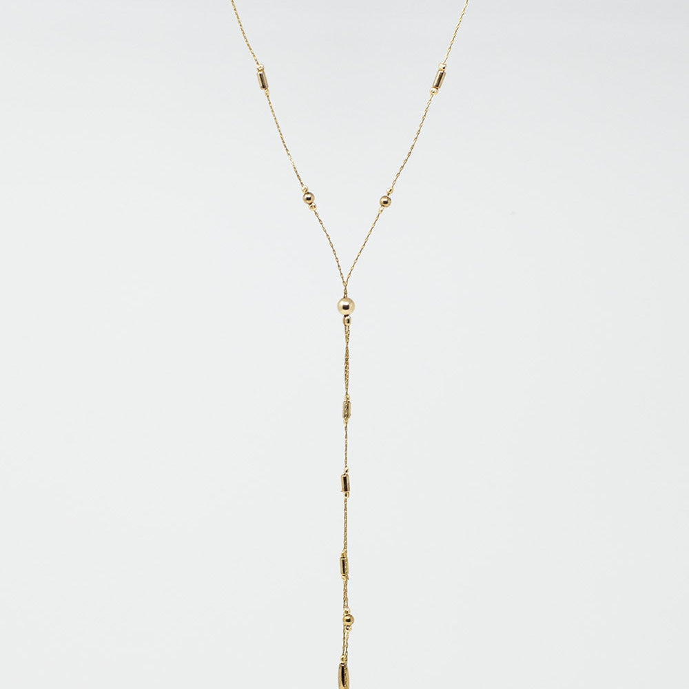 Long Gold Necklance With Golden Beads Throughout and Long Golden Tassle