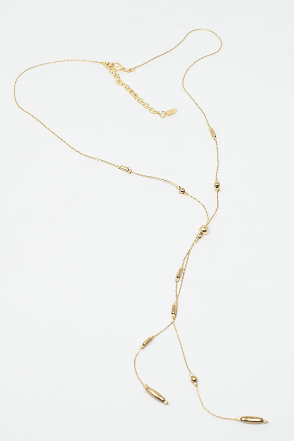 Long Gold Necklance With Golden Beads Throughout and Long Golden Tassle